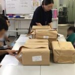 工賃作業（訂正シール貼り）